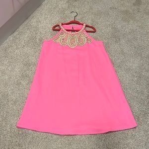 Lilly Pulitzer girls pink dress with gold trim.
